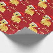 サンタの帽子を持つかわいく黄色いベビーDinosour ラッピングペーパー (角)