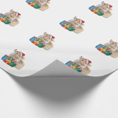 サンタの帽子を持つウェルシュコーギーの子犬 ラッピングペーパー (角)