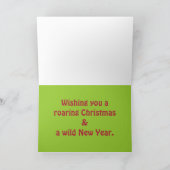 サンタの帽子を身に着けているクリスマスのライオン シーズンカード (内部)