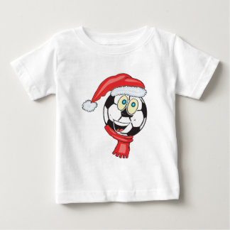 サンタの帽子を身に着けている楽しいクリスマスのサッカーボール ベビーTシャツ