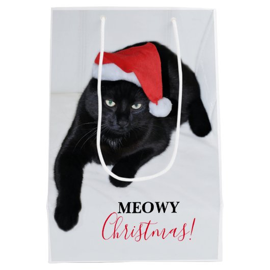 サンタの赤い帽子を持つ猫 ミディアムペーパーバッグ (裏面)