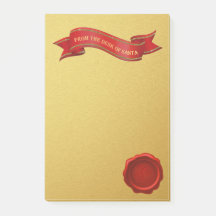 サンタの金ゴールドのポスト・イットの机から