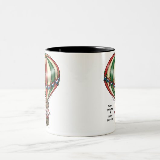 サンタは熱気の気球からのよい応援を広げます ツートーンマグカップ (中央)