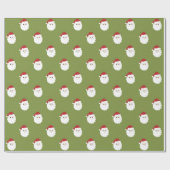 サンタは緑のクリスマスの包装紙で直面します ラッピングペーパー (フラット)
