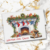 サンタクリスマス暖炉でボクサーの子犬が待つ