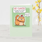 サンタクロースおもしろいのクリスマスに横たわる猫 カード (黄色い花)