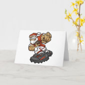 サンタクロースがサッカーをプレイするイラスト カード (黄色い花)