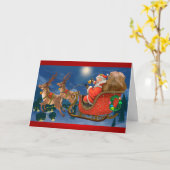サンタクロースがソリに乗る カード (黄色い花)