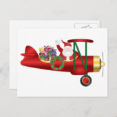 サンタクロースがビプレーンでギフトポストカードを手に シーズンポストカード (正面/裏面)