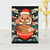 サンタクロースがラーメンを食べる日本的なクリスマス カード (黄色い花)