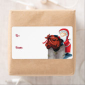 サンタクロースが煙突のクリスマスプレゼントに入る ラベル (インサイチュ)