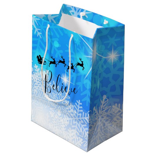 サンタクロースと彼飛んでいるのトナカイ信じ- ミディアムペーパーバッグ (裏面アングル)