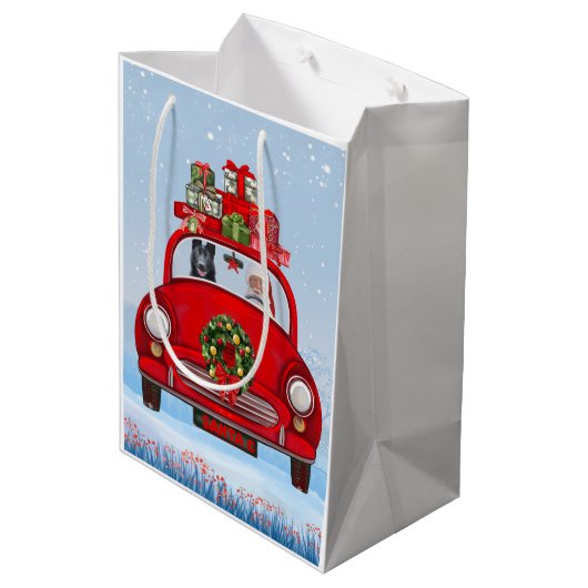 サンタクロースと車で黒いドイツの羊飼い犬 ミディアムペーパーバッグ (裏面アングル)