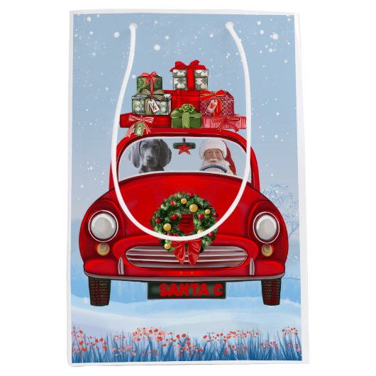 サンタクロースと車に乗ったワイマランアドッグ ミディアムペーパーバッグ (正面)