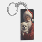 サンタクロースと過ごすクリスマスのアメリカン・エスキモー犬 キーホルダー (正面左)