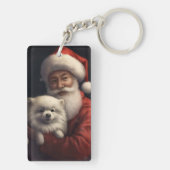 サンタクロースと過ごすクリスマスのアメリカン・エスキモー犬 キーホルダー (裏面)