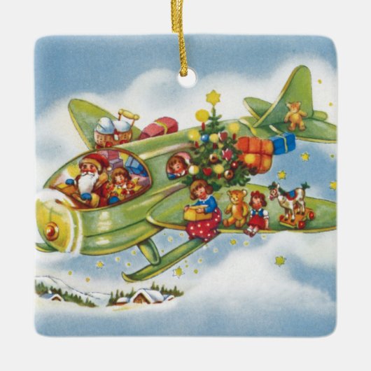 サンタクロースと飛行機のヴィンテージ飛んでいるクリスマス セラミックオーナメント (正面)