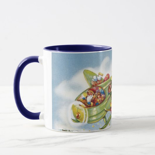サンタクロースと飛行機のヴィンテージ飛んでいるクリスマス マグカップ (左)