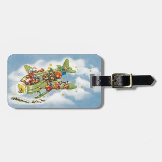サンタクロースと飛行機のヴィンテージ飛んでいるクリスマス ラゲッジタグ (正面横)