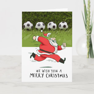サンタクロースのボールを持つ遊サッカークリスマス カード