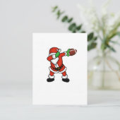 サンタクロースの軽く押えるクリスマスのフットボールの接地 シーズンポストカード (スタンド正面)