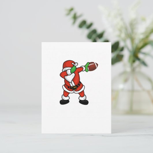 サンタクロースの軽く押えるクリスマスのフットボールの接地 シーズンポストカード (スタンド正面)