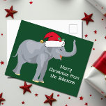 サンタクロースハットグリーンのかわいいクリスマスゾウ ポストカード<br><div class="desc">クリスマスは可愛い休日お気に入りのの動物が私の一部だ。赤いかわいらしサンタ帽をかぶった象が幸せそうに見える。これは私にクリスマス精神を満たす。このポストカードを自分の休暇メッセージでカスタマイズする。</div>