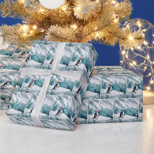 サンタクロース帽子を持つクリスマスペンギン ラッピングペーパー