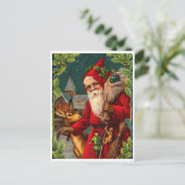 サンタクロース来は贈り物でいっぱいのバッグを持っている ポストカード (スタンド正面)