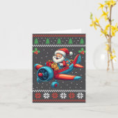 サンタクロース飛んでいる飛行機の醜いクリスマスセーター カード (黄色い花)