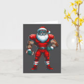 サンタクロース アメリカンフットボールプレーヤー 楽しいクリスマス カード (黄色い花)