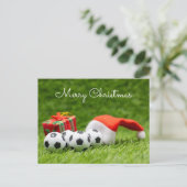 サンタハットが緑に浮かぶサッカークリスマスホリデー ポストカード (スタンド正面)
