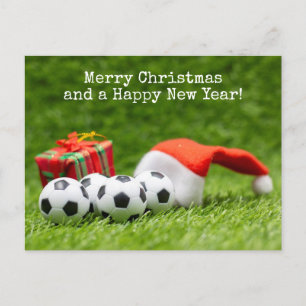 サンタハットとギフト付きサッカークリスマスホリデー シーズンポストカード
