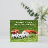 サンタハットとギフト付きサッカークリスマスホリデー シーズンポストカード (スタンド正面)