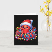 サンタハットとホリデーライト付きクリスマスタコ カード (黄色い花)