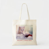 サンタハットに眠るクリスマスに休むかわいい子猫 トートバッグ (正面)