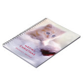 サンタハットに眠るクリスマスに休むかわいい子猫 ノートブック (左側)