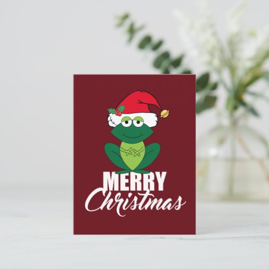 サンタハットのかわいい赤でメリークリスマスのカエル シーズンポストカード (スタンド正面)