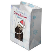 サンタハットのクリスマスプーンを着たかわいいカワウソ ミディアムペーパーバッグ (裏面アングル)