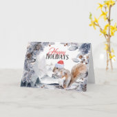 サンタハットの冬の森の風景を身に着けたリス カード (黄色い花)