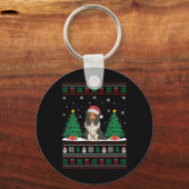 サンタハットひげを付けたコリードッグクリスマスツリーが醜く点灯 キーホルダー (正面)