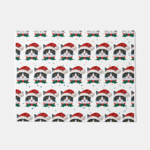 サンタハットクリスマスを迎えるかわいい黒猫 ドアマット