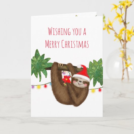 サンタハットクリスマスカードのかわいいナマケモノ カード (黄色い花)