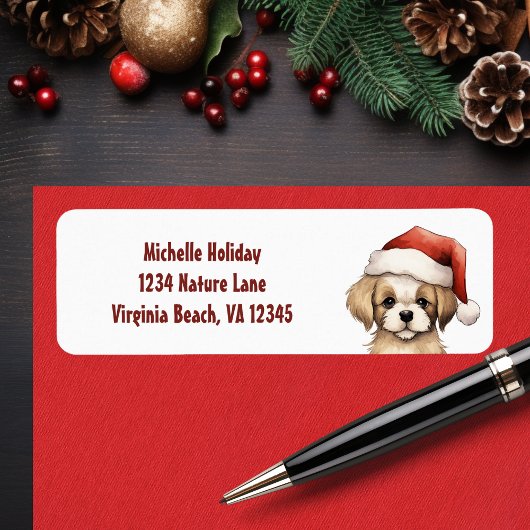 サンタハット犬のクリスマスアドレスを着たかわいい子犬 ラベル