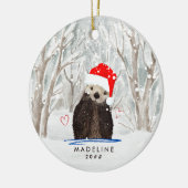 サンタハット・キッドの名前を冠ったかわいいカワウソ セラミックオーナメント (左)