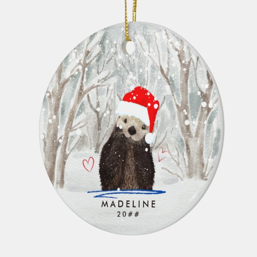 サンタハット・キッドの名前を冠ったかわいいカワウソ セラミックオーナメント (左)