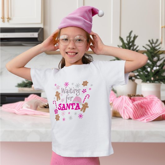 サンタホットピンクのクリスマスキャンディの名前を待っている Tシャツ