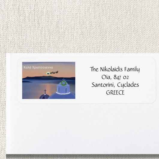 サンタリターンを伴うギリシャのサントリーニでのクリスマス ラベル