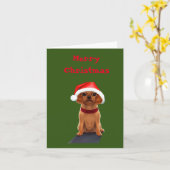 サンタ帽をかぶったかわいい子犬のブランケット カード (黄色い花)