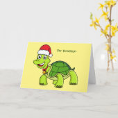 サンタ帽をかぶったかわいい幸せなトカゲ カード (黄色い花)